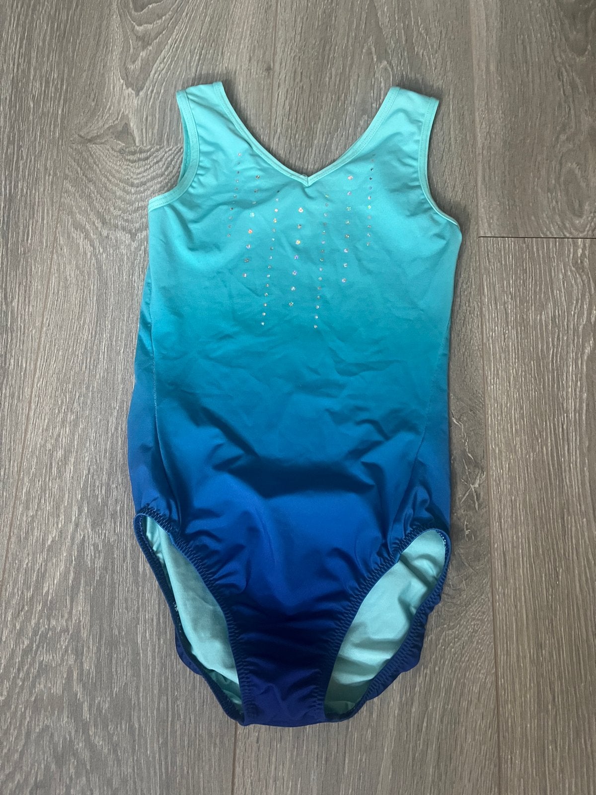 Blauw-groen turnpakje met glitterdetails, Ophalen of Verzenden, Zo goed als nieuw, Meerkleurig