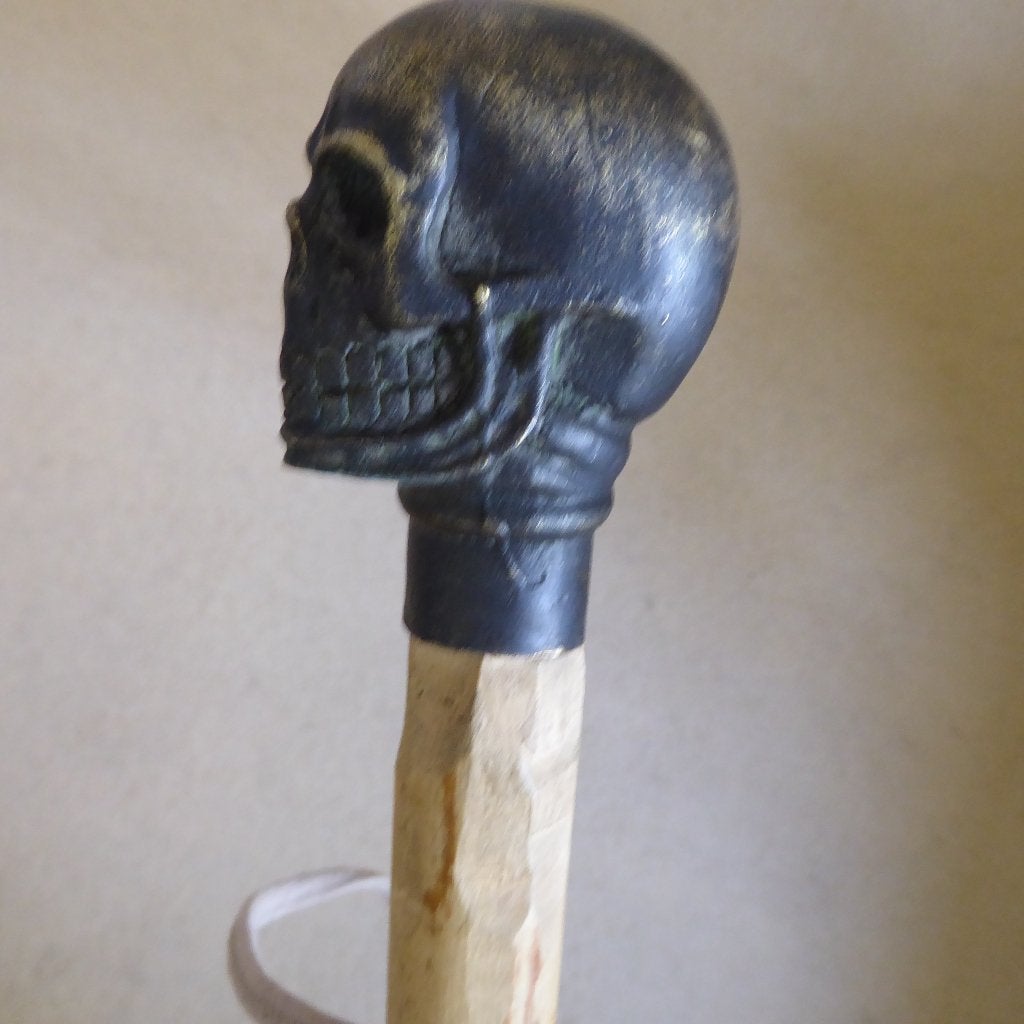 wandelstok met bronzen (schedel-)kop, Ophalen