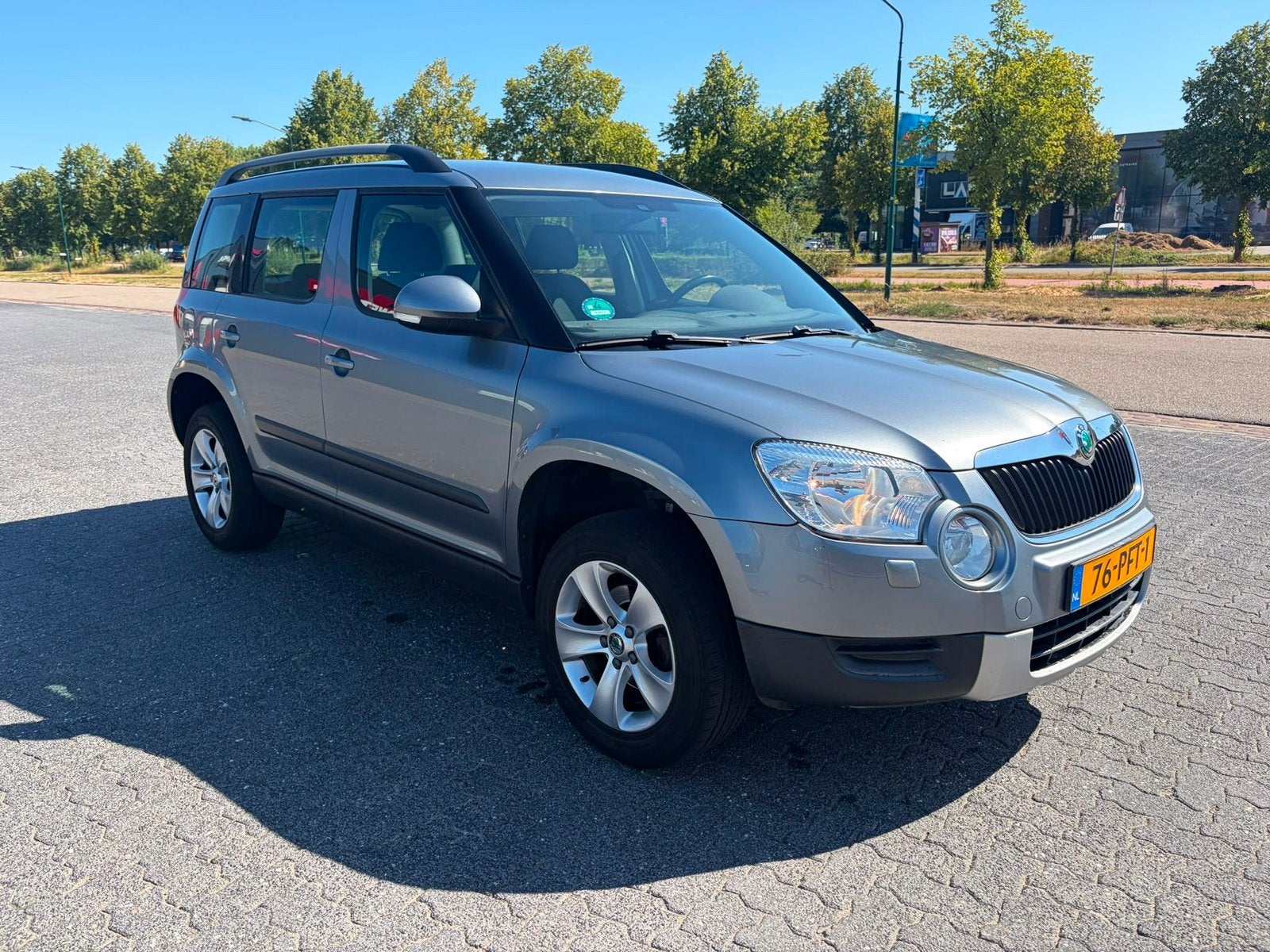 Skoda Yeti 1.2 TSI 77KW 2011 Grijs, Auto's, Skoda, Voorwielaandrijving, Euro 5, Stof, Zwart