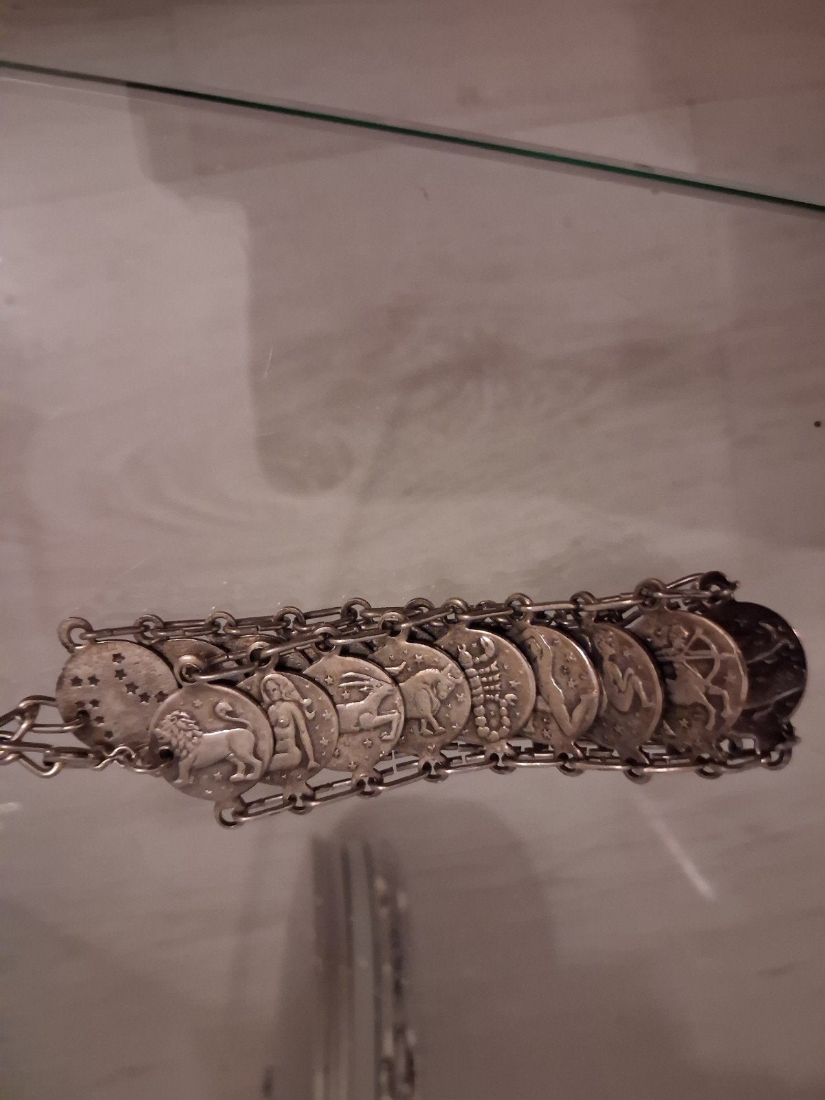Zilverkleurige Armband met Sterrenbeeld Munten, Ophalen of Verzenden, Gebruikt, Zilver, Staal
