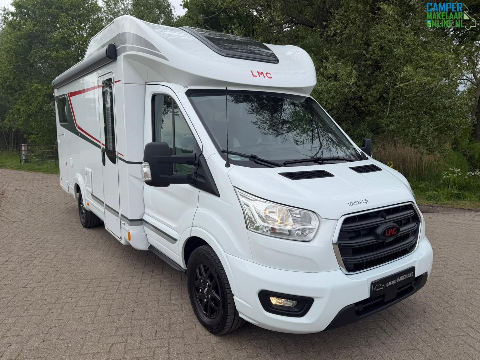 LMC Tourer Lift H664 G-Enkele bedden-Hefbed, Caravans en Kamperen, Automaat, Ringverwarming, Luifel, 7 tot 8 meter