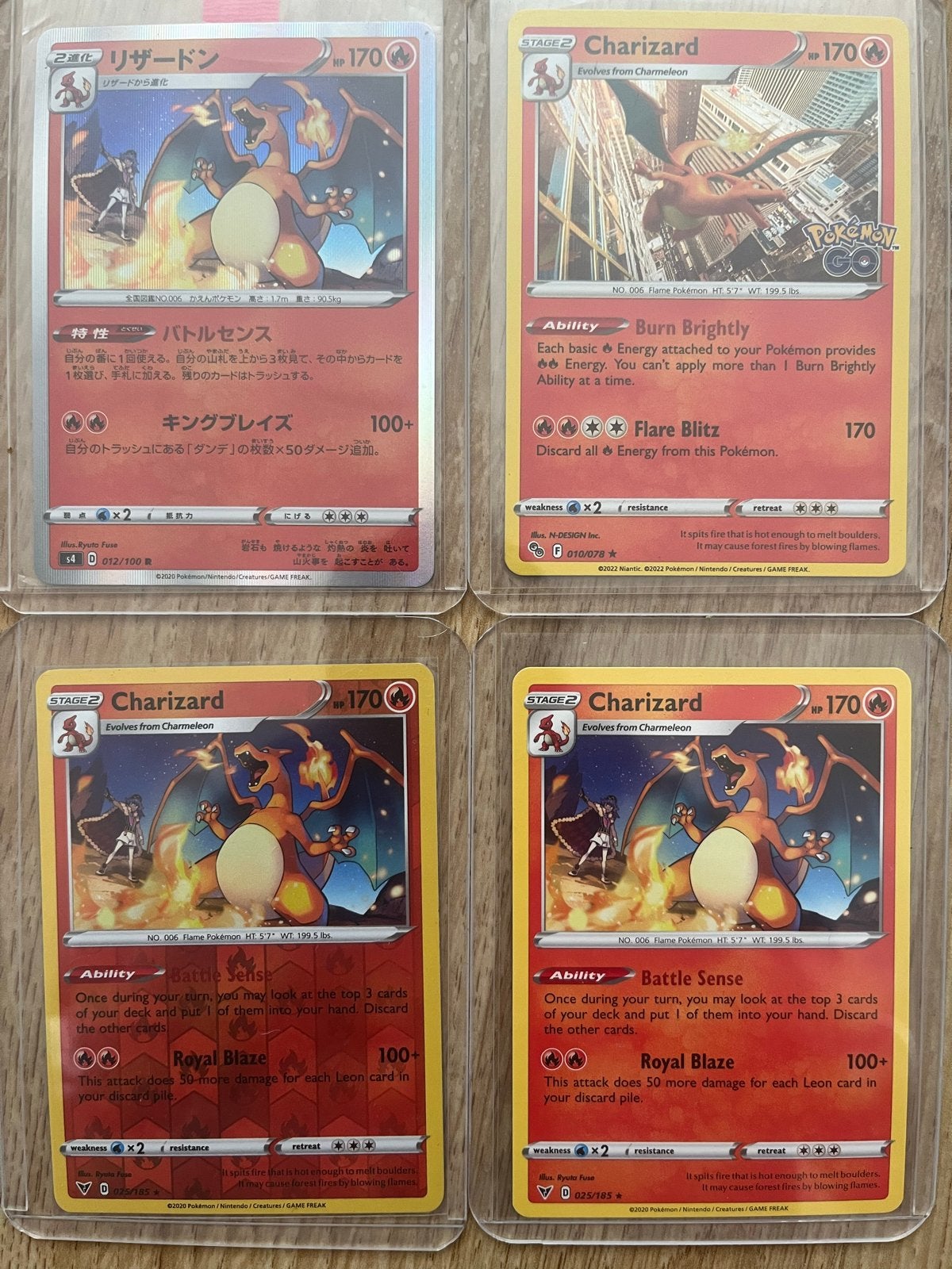 Set van 4 Charizard Pokémon kaarten (3 Engels, 1 Japans), Ophalen of Verzenden, Zo goed als nieuw, Meerdere kaarten