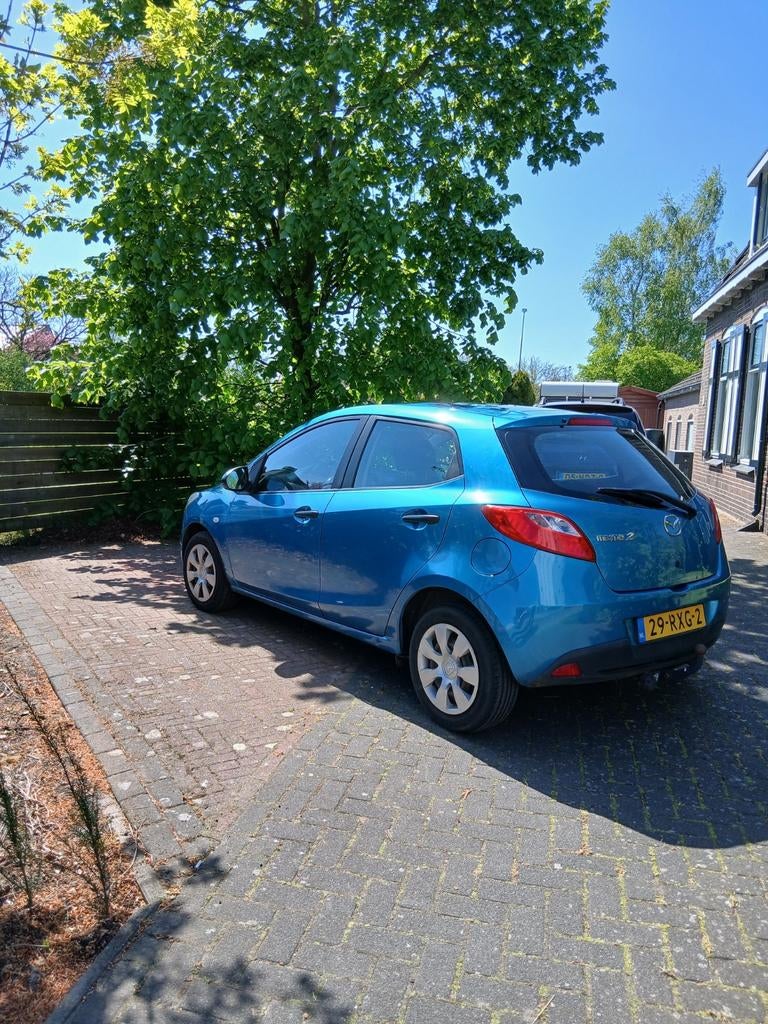 Mazda 2 1.3 75pk 5D 2011 Blauw, Auto's, Voorwielaandrijving, Stof, 74 pk, 4 cilinders
