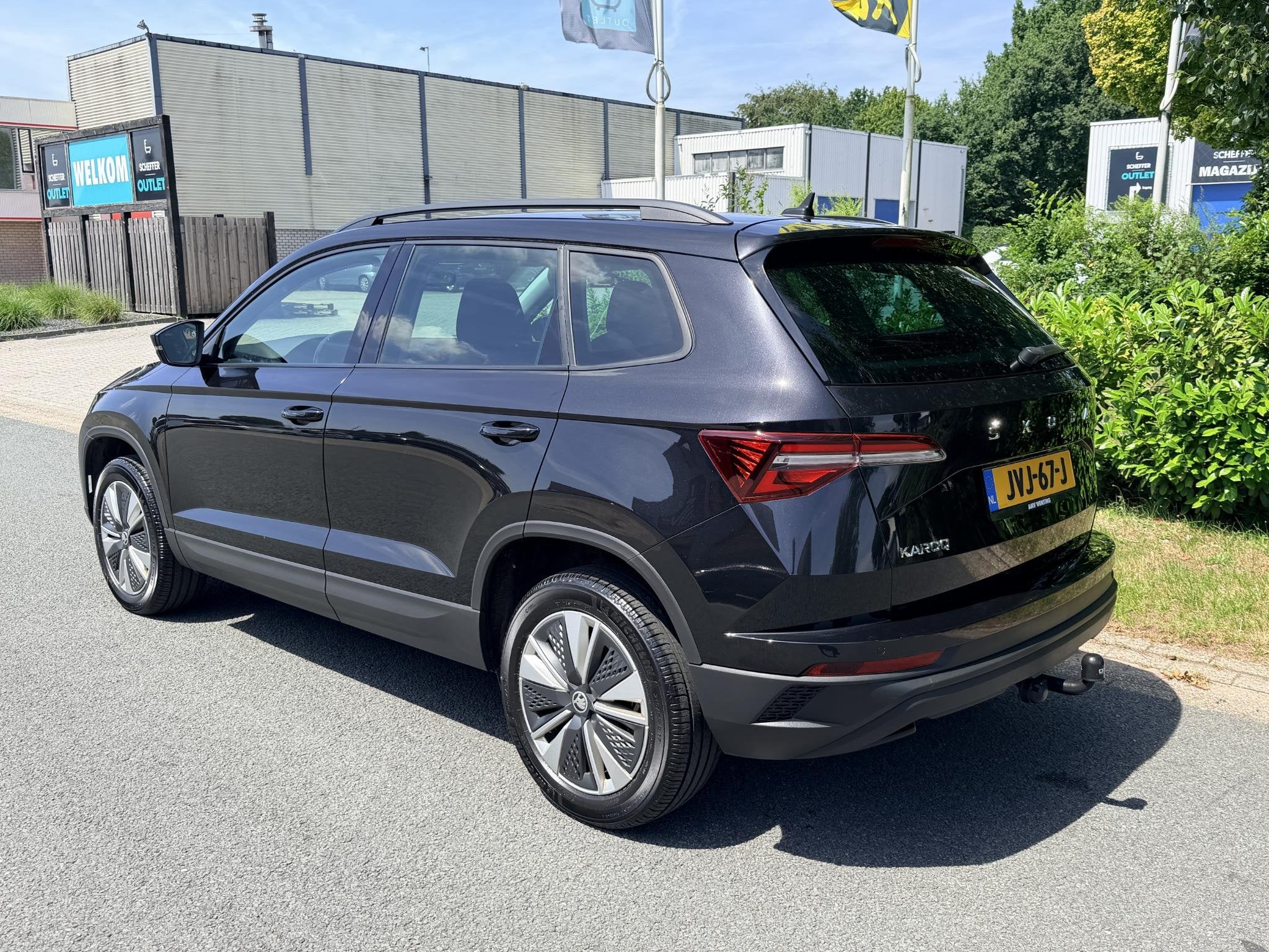 Skoda Karoq 1.5 TSI ACT 150PK DSG Trekhaak•Navi, Auto's, Stof, 4 cilinders, Zwart, Karoq
