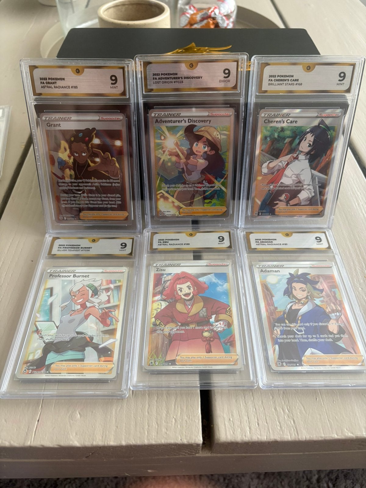 Trainer slab grade 9, Ophalen of Verzenden, Zo goed als nieuw, Meerdere kaarten, Foil