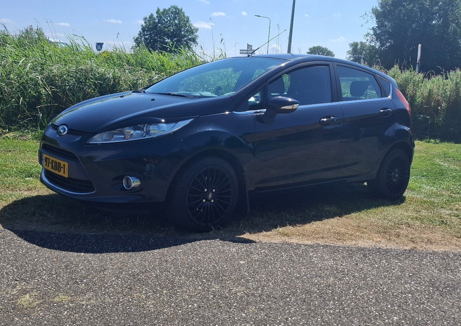 Ford Fiësta 1.25 60KW 5DR 2009 Zwart, Auto's, Voorwielaandrijving, Stof, Zwart, Origineel Nederlands
