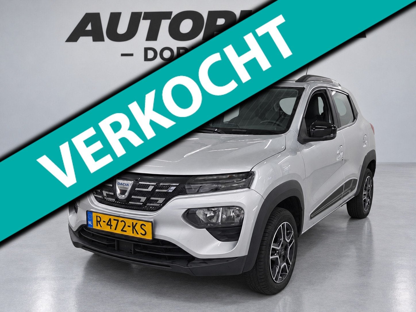 Dacia Spring Comfort Plus (Orange Pack) 27 kWh- SOH 89% |Cam, Auto's, Dealer onderhouden, Stof, Gebruikt, 230 km