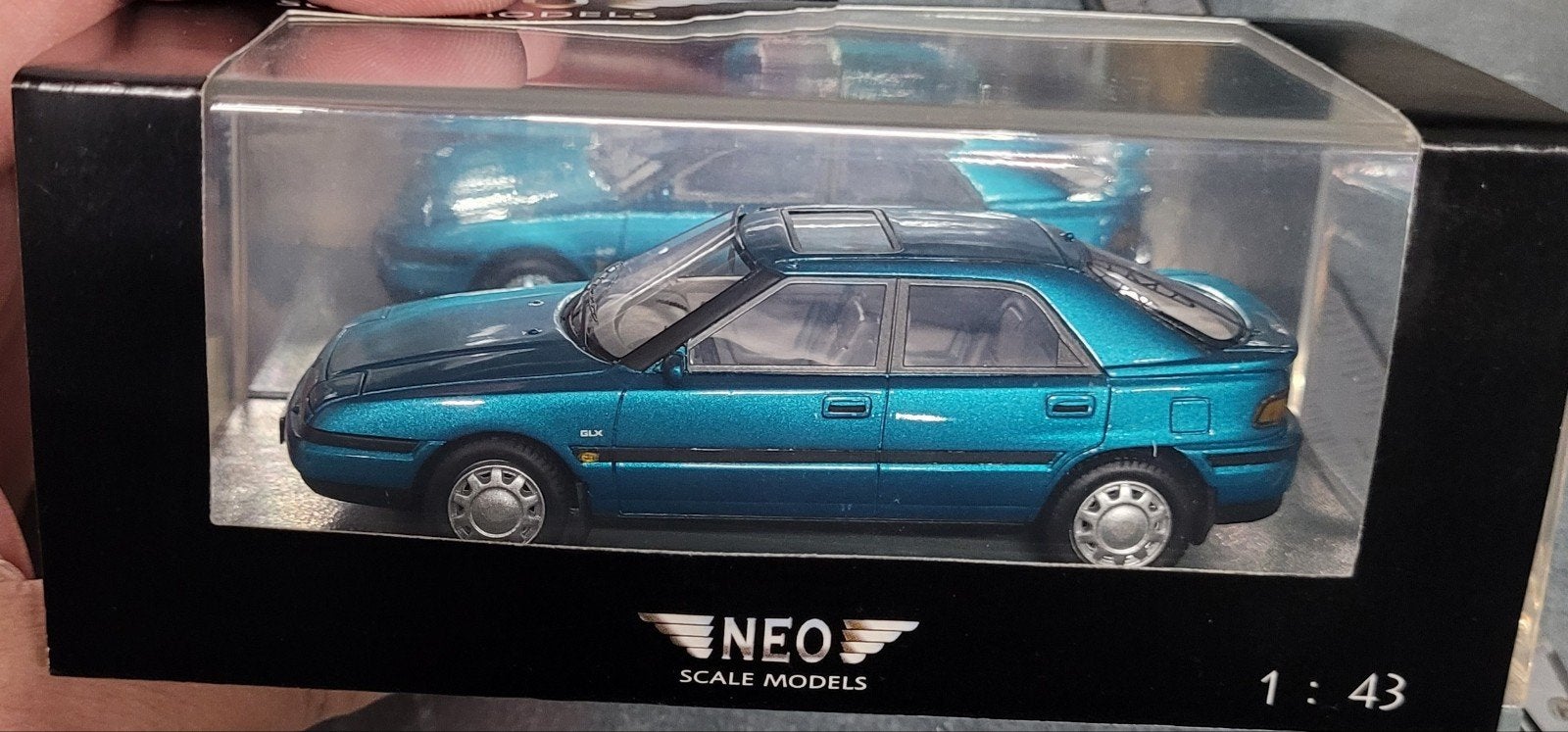 mazda 323f bg Neo 1/43, Ophalen of Verzenden, Zo goed als nieuw, Auto, Overige merken