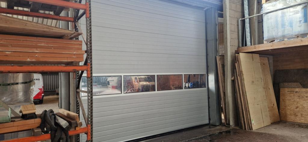 Industriele overheaddeur / sectionaaldeur electrisch bediend, Ophalen, Gebruikt, Garagedeur, 120 cm of meer