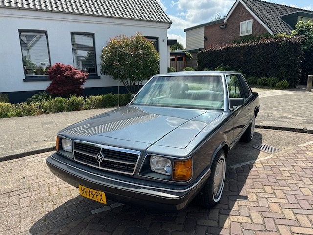 Dodge Aries 2.2 LE Coach (bj 1987, automaat), Auto's, Oldtimers, Bedrijf, Grijs, 2213 cc, Sedan