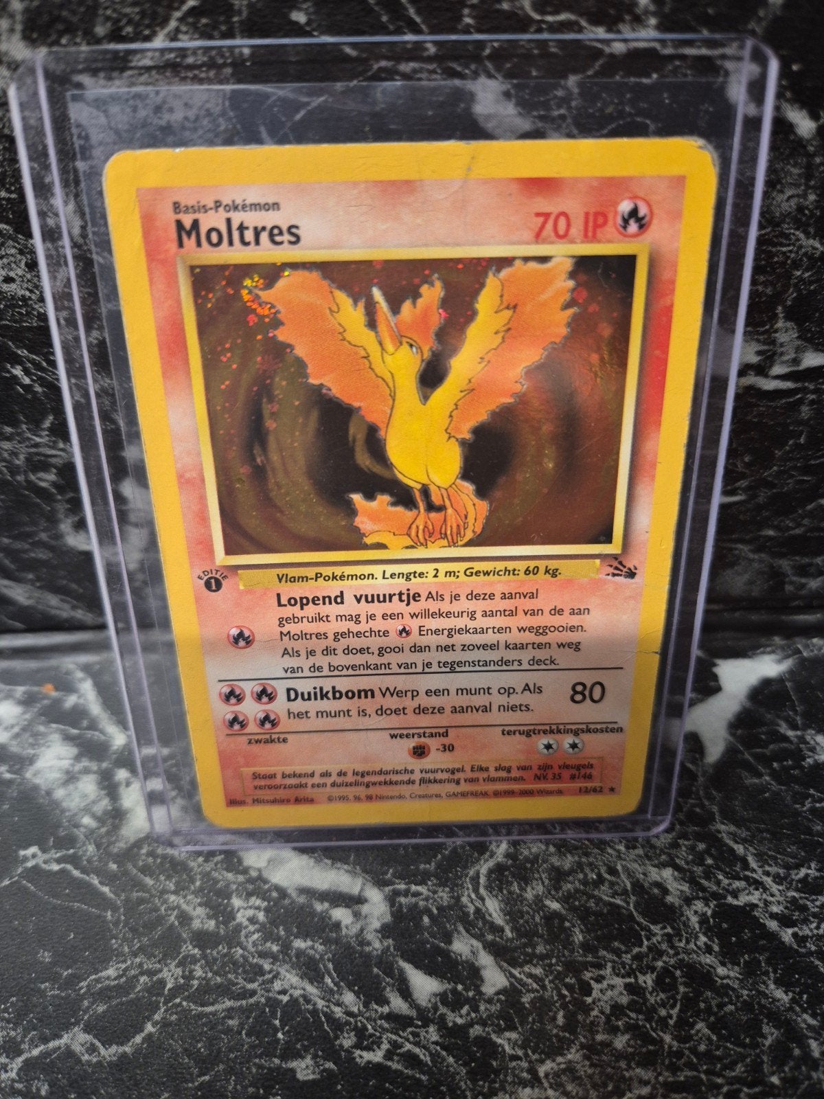 Moltres Holo 1e Editie Pokémon Kaart - Fossil Set, Ophalen of Verzenden, Zo goed als nieuw, Losse kaart, Foil