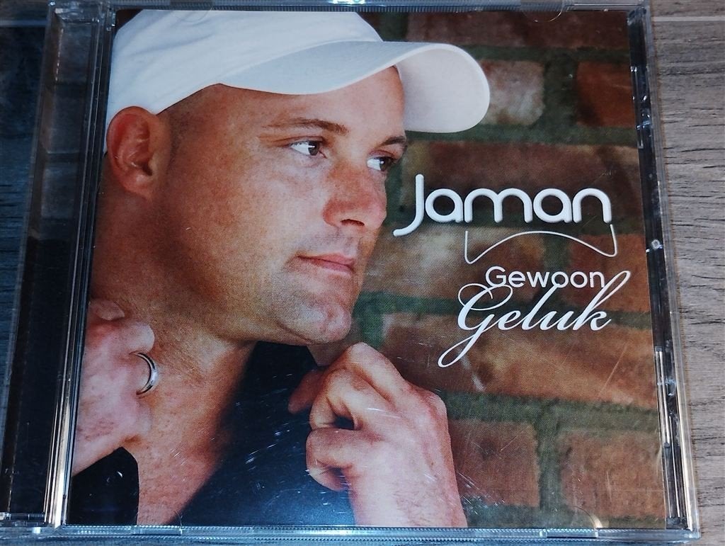 Jaman - Gewoon Geluk, Ophalen of Verzenden, Zo goed als nieuw, Levenslied of Smartlap