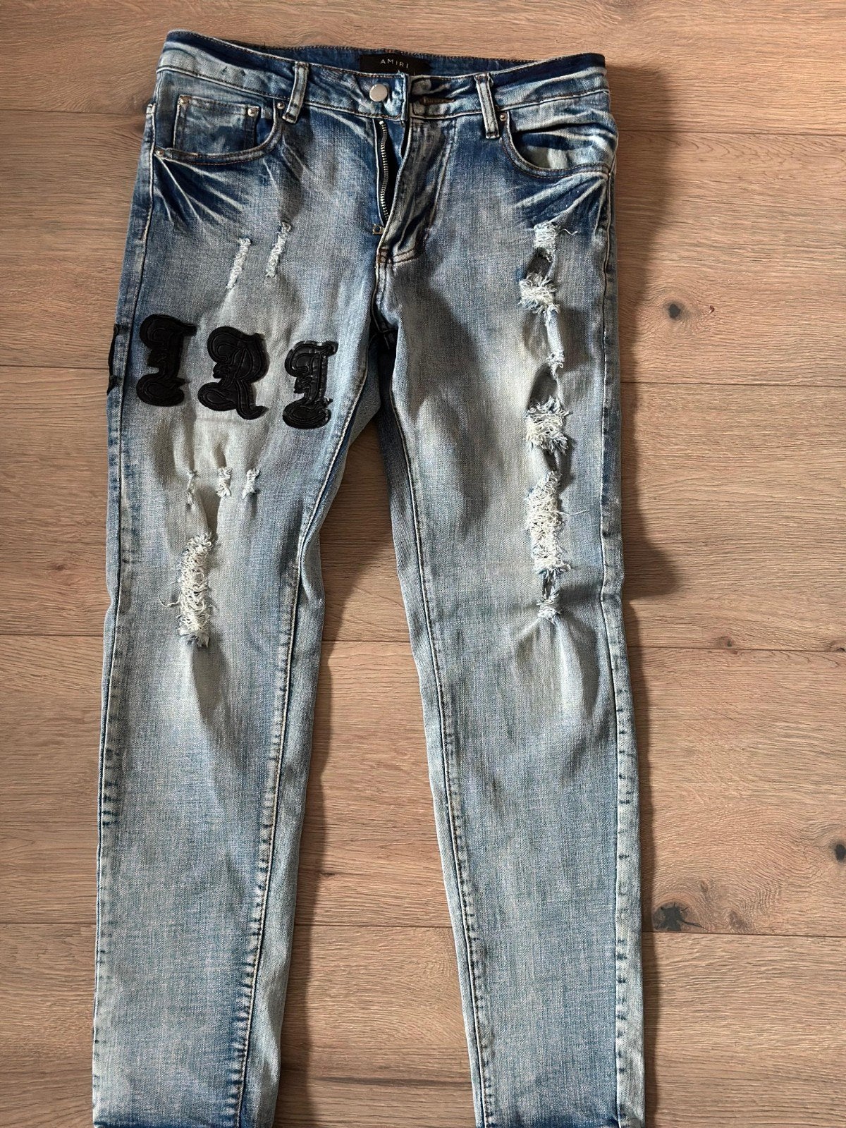 Amiri jeans maat 31 met distressed details en patches, Blauw, W32 (confectie 46) of kleiner, Ophalen of Verzenden, Amiri