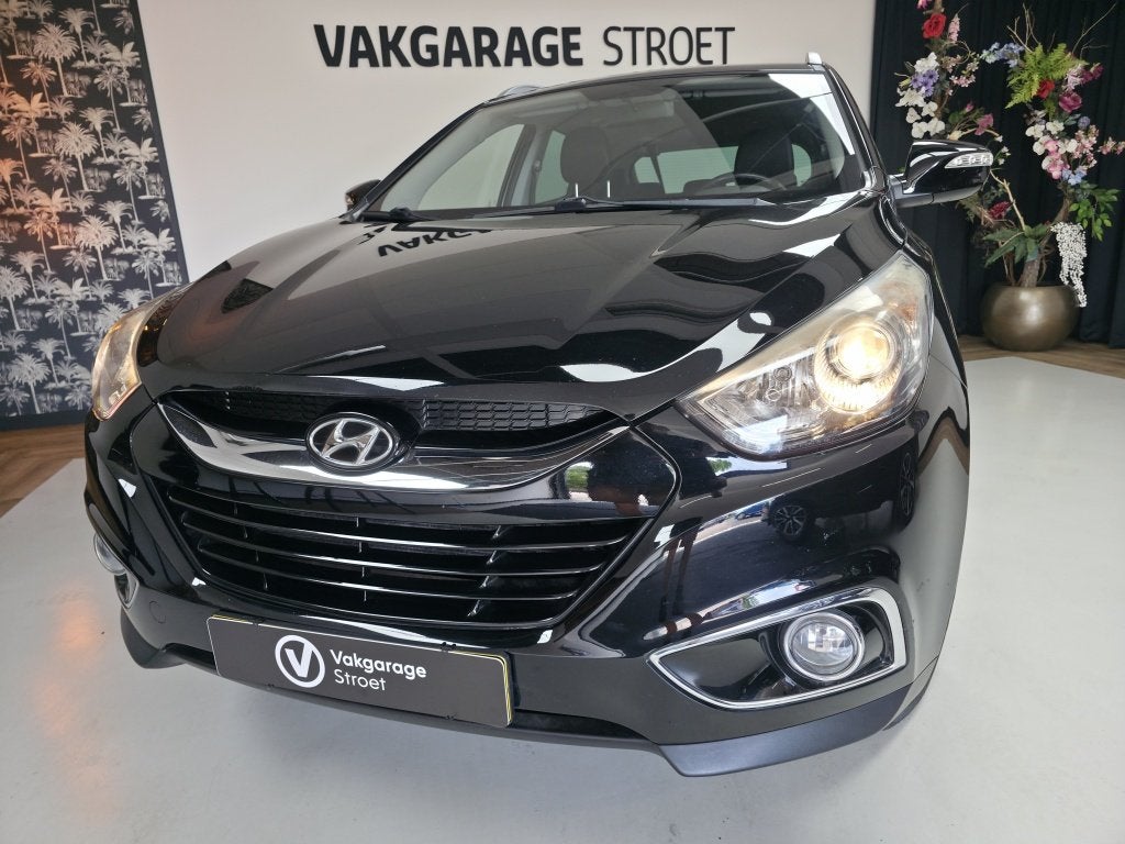 Hyundai ix35 2.0i Bus.Ed. | cruise | cam | clima | trekhaak, Auto's, Hyundai, Gebruikt, Zwart, 4 cilinders, Leder en Stof