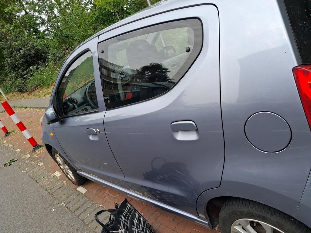 Nissan Pixo 1.0 50KW 5D 2010 Grijs, Auto's, Nissan, Voorwielaandrijving, Stof, 200 kg, 4 stoelen
