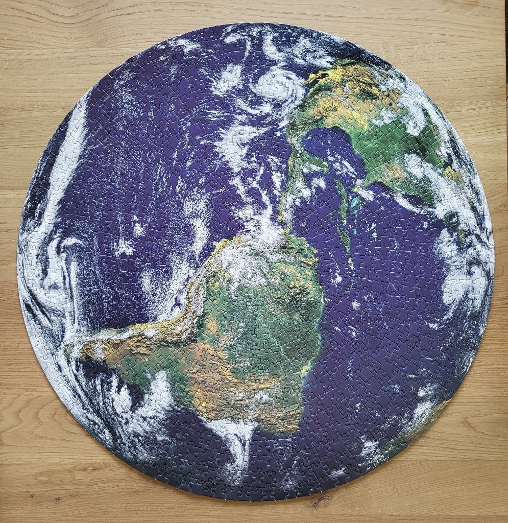 Ronde legpuzzel van 1000 stukjes - Planet Earth, Ophalen of Verzenden, 500 t/m 1500 stukjes, Zo goed als nieuw, Legpuzzel