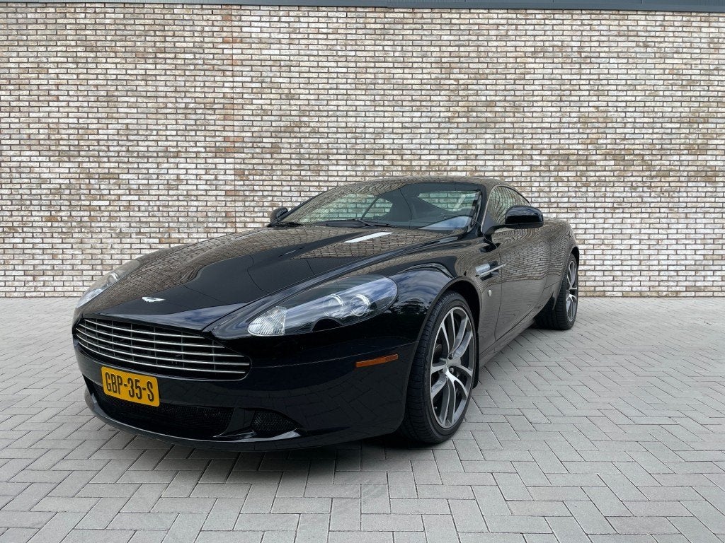 Aston martin DB9 5.9-L V12 Touchtronic/Cruise control/470 PK, Auto's, Aston Martin, Gebruikt, Met garantie (alle), Zwart, Leder