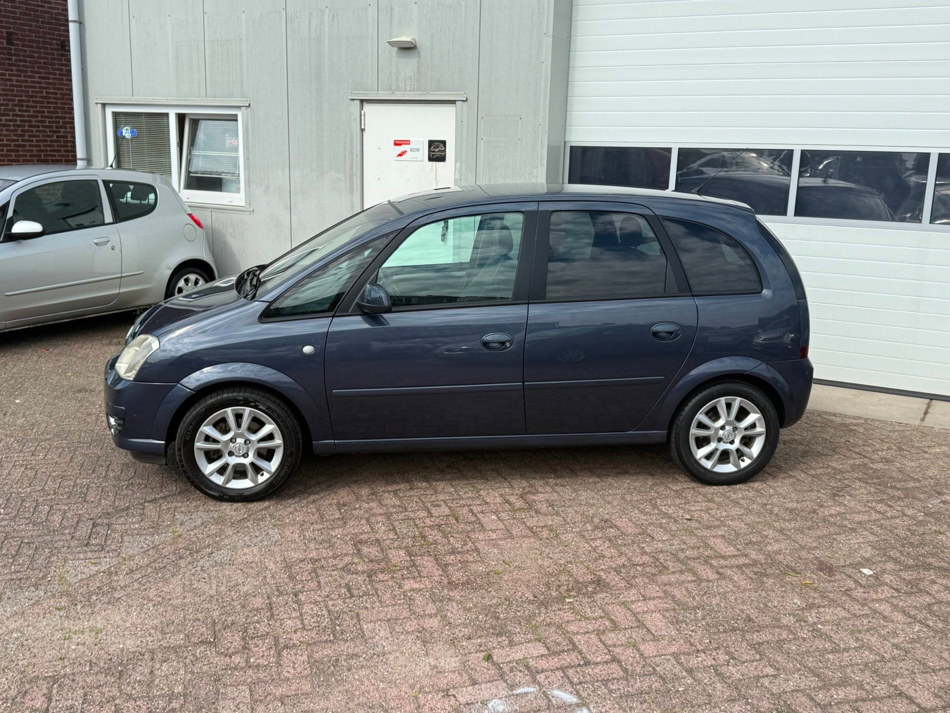Opel Meriva 1.6-16V Cosmo, Auto's, Voorwielaandrijving, 15 km/l, 4 cilinders, Blauw