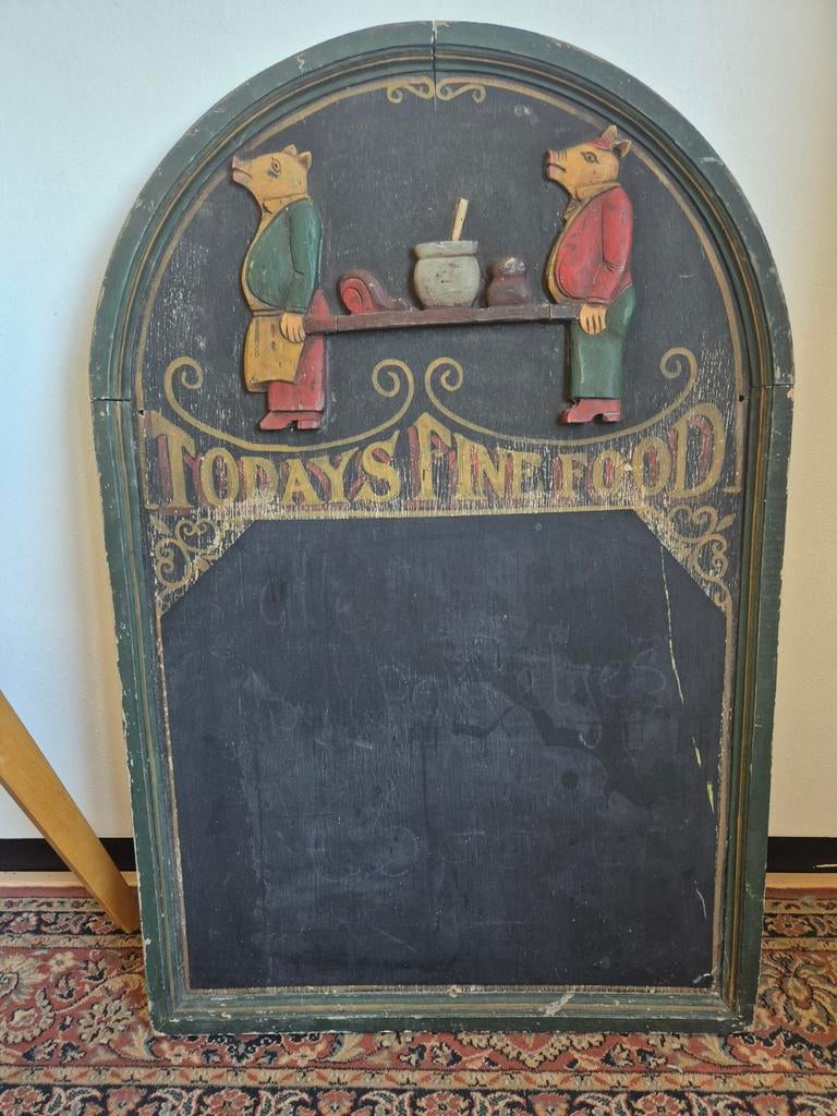 Krijtbord met varkens in relief, Ophalen