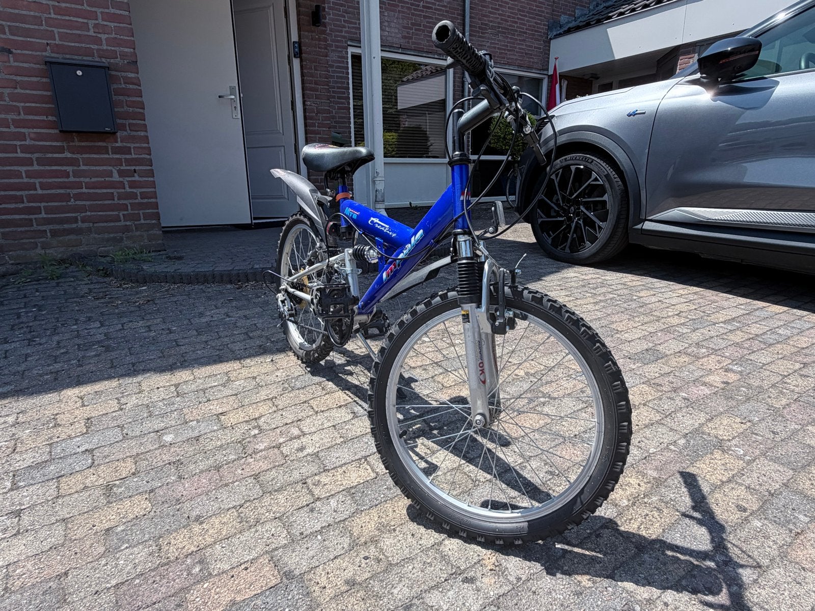 Blauwe kinderfiets met vering en 20 inch wielen, Ophalen, Staal, Velgrem, V-brakes