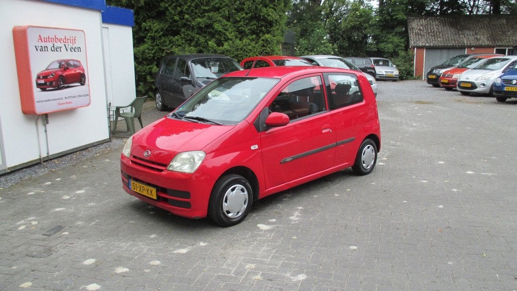 Daihatsu Cuore 1.0-12V Tokyo, Auto's, Daihatsu, Stof, 18 €/maand, 4 stoelen, Cuore