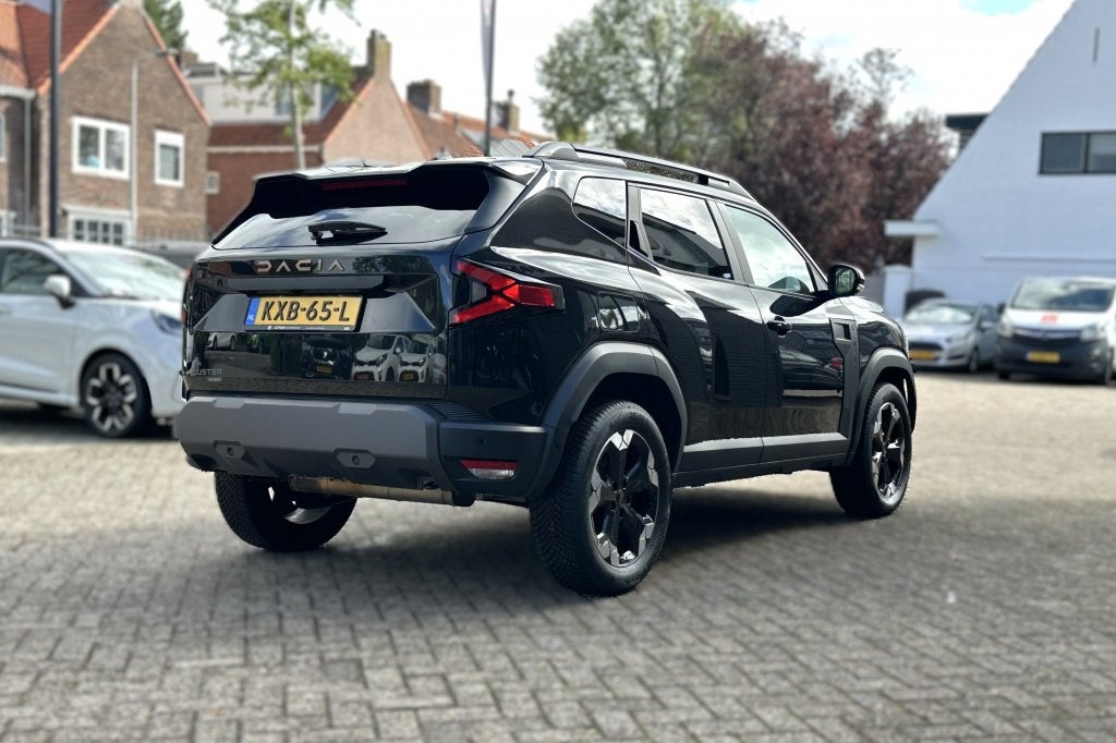 Dacia Duster 1.6 Hyb 140 Ext. (bj 2025, automaat), Auto's, 12 maanden, Gebruikt, 4 cilinders, Zwart