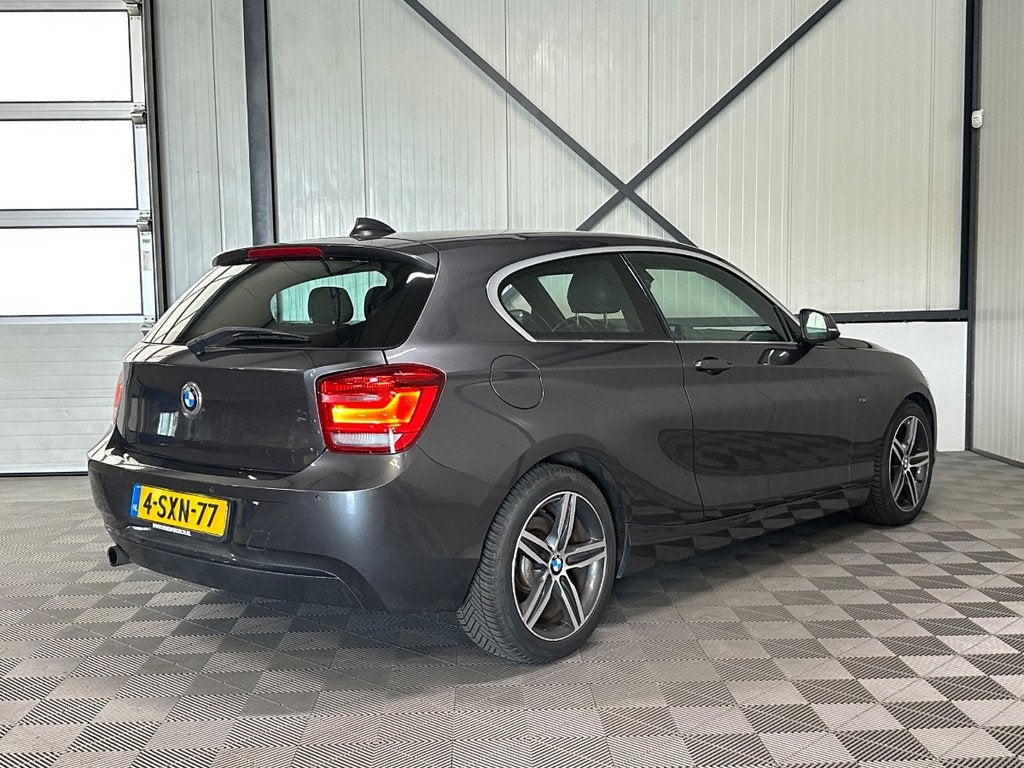 BMW 1-serie 116i 100kw | Executive Sport | Leer | Navi | Xen, Auto's, 136 pk, Gebruikt, Euro 6, 4 cilinders