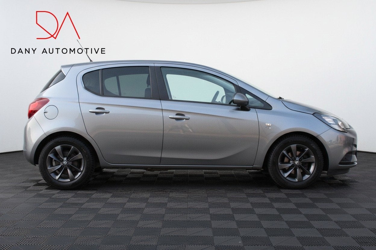 Opel Corsa 1.4 120 Jahre VOL AUTOMAAT I CARPLAY I CAMERA I S, Auto's, Stof, Gebruikt, 4 cilinders, Bedrijf