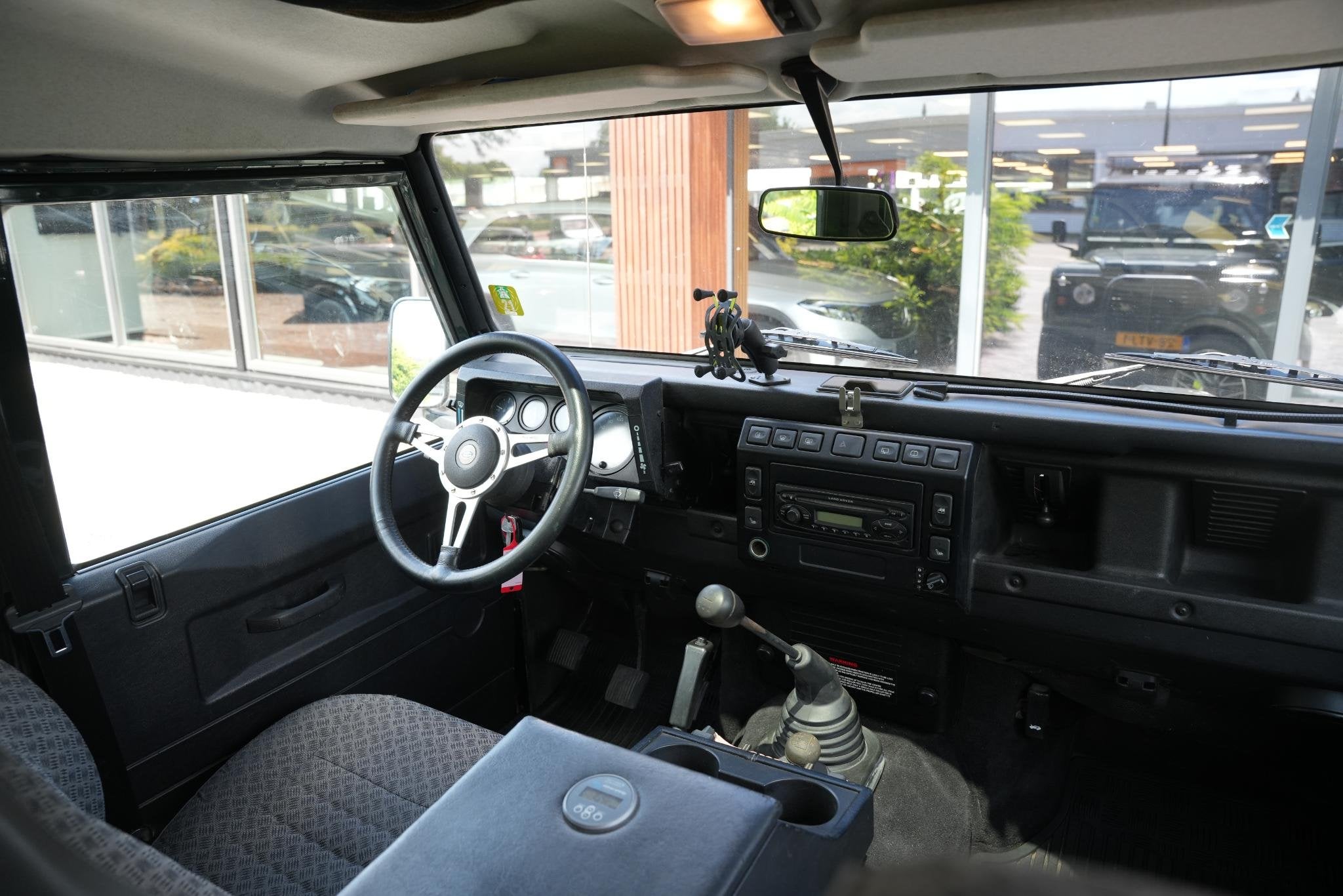 Land Rover Defender 2.5 Td5 SW 110" E, Auto's, Land Rover, Stof, Gebruikt, 2495 cc, 122 pk