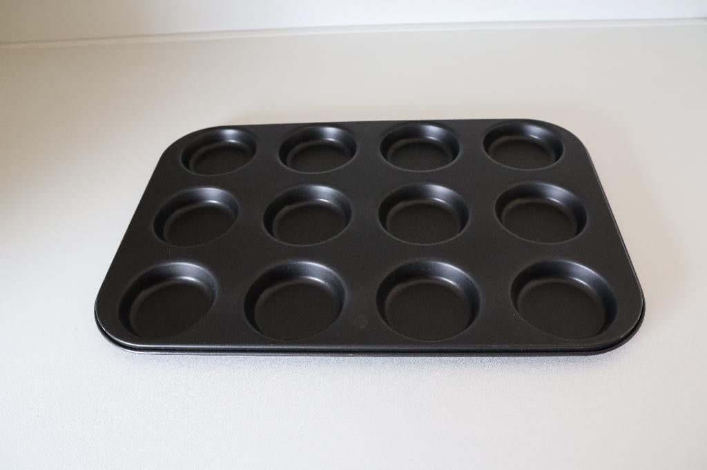 Bakvorm voor cupcakes zwart nieuw., Ophalen of Verzenden, Nieuw, Cupcakes, Bakvorm