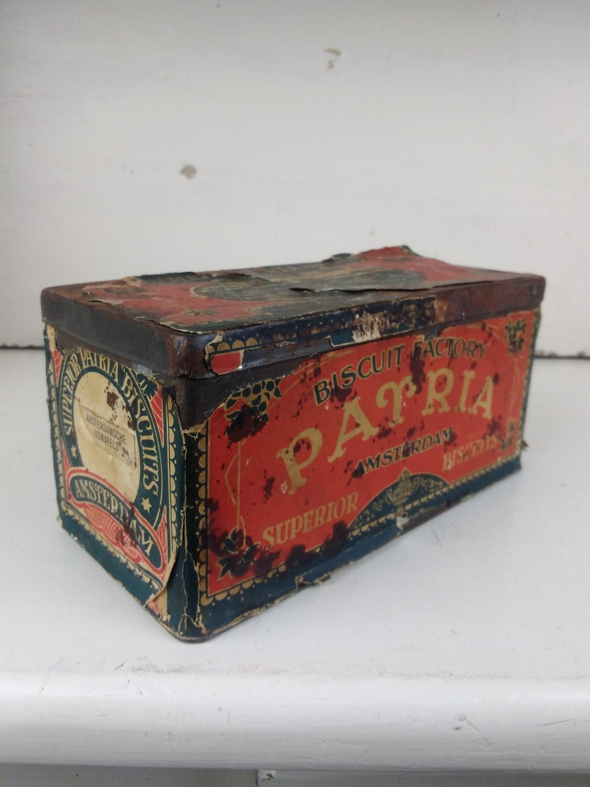 Antiek Patria Biscuitblik - Amsterdam 1906/1911, Verzamelen, Ophalen of Verzenden, Gebruikt, Koek(jes), Overige merken