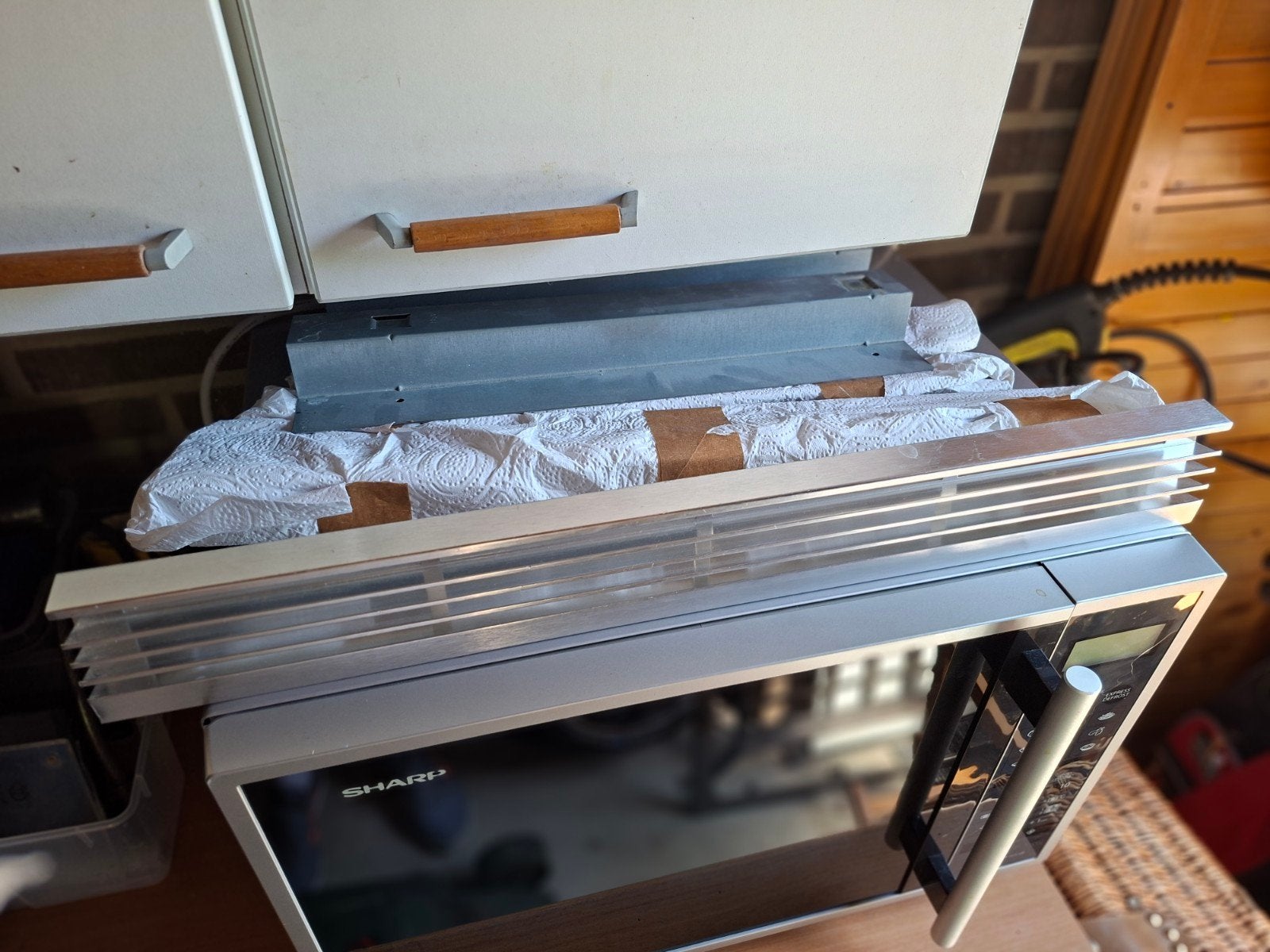 Sharp inbouwframe EBR9900W, Ophalen