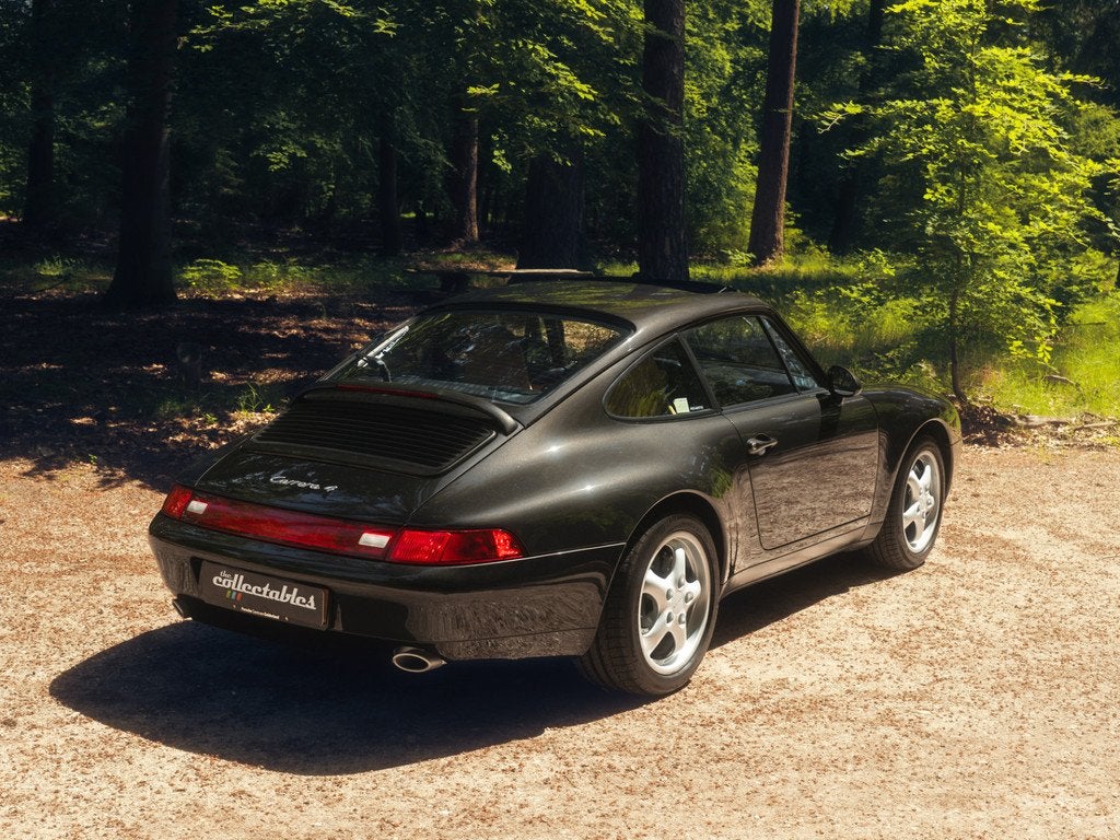 Porsche 911 3.6 Carrera 4 Coupé Handgeschakeld (bj 1995), Auto's, Oldtimers, Cruise Control, 4 stoelen, Zwart, Bedrijf