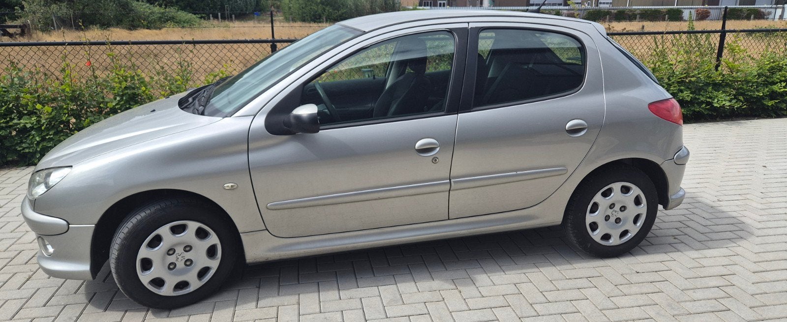 Peugeot 206 1.4 5D 2006 Grijs, Auto's, Voorwielaandrijving, Stof, 4 cilinders, Origineel Nederlands