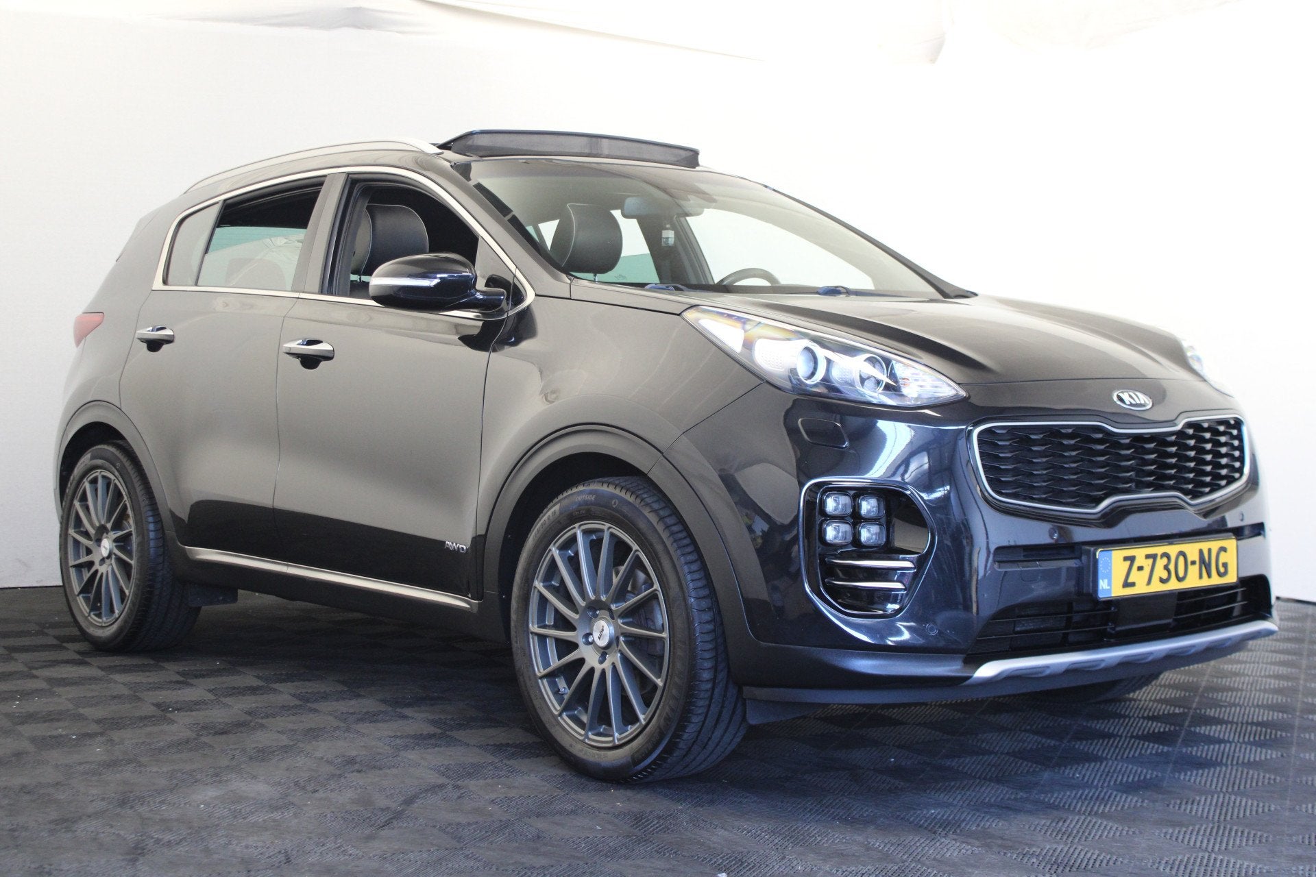 Kia Sportage 1.6 T-GDI 4WD GT-Line PlusLine (bj 2016), Auto's, Gebruikt, 4 cilinders, Zwart, Leder