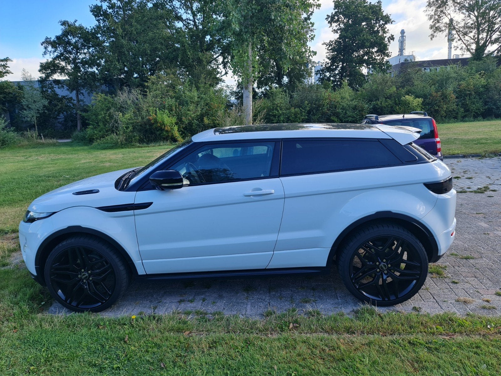 Land Rover Range Rover Evoque coupe SI4 4WD AUT 2011 Wit, Auto's, Automaat, 1800 kg, 4 cilinders, 4 stoelen
