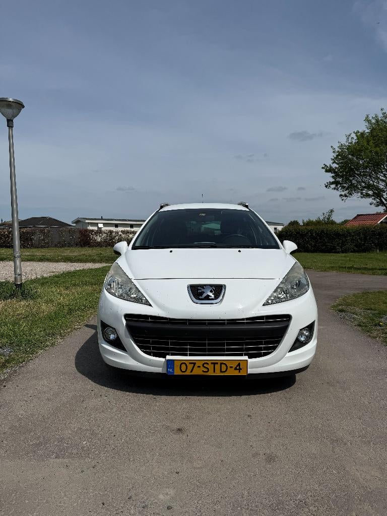 Peugeot 207 1.4 VTI 16V SW 2011 Wit met Nieuwe APK, Auto's, Voorwielaandrijving, Stof, Zwart, Wit