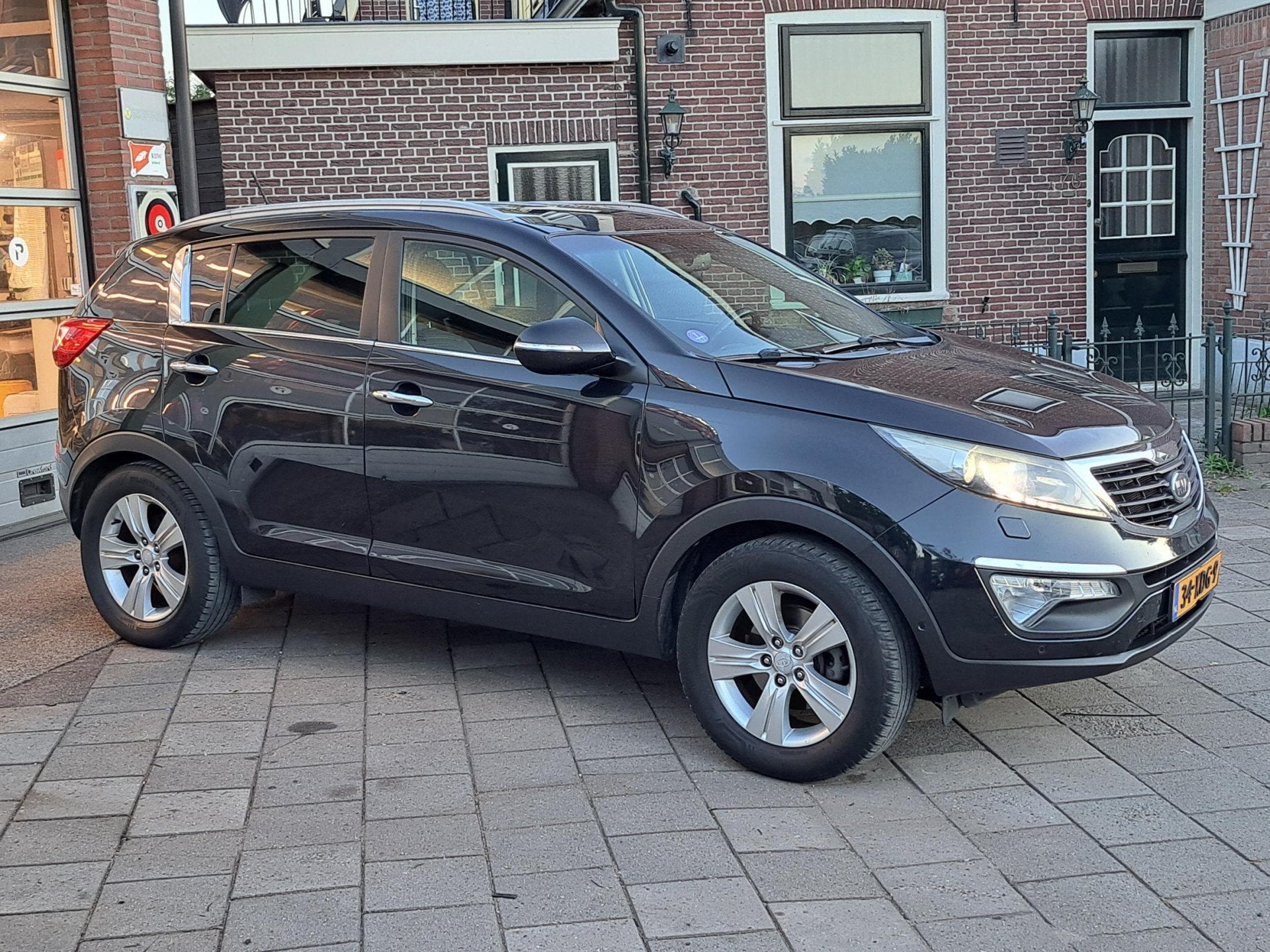 Kia Sportage 1.6 GDI Super Pack/Trekhaak/Leer/Navi, Auto's, 135 pk, 4 cilinders, Zwart, 1200 kg
