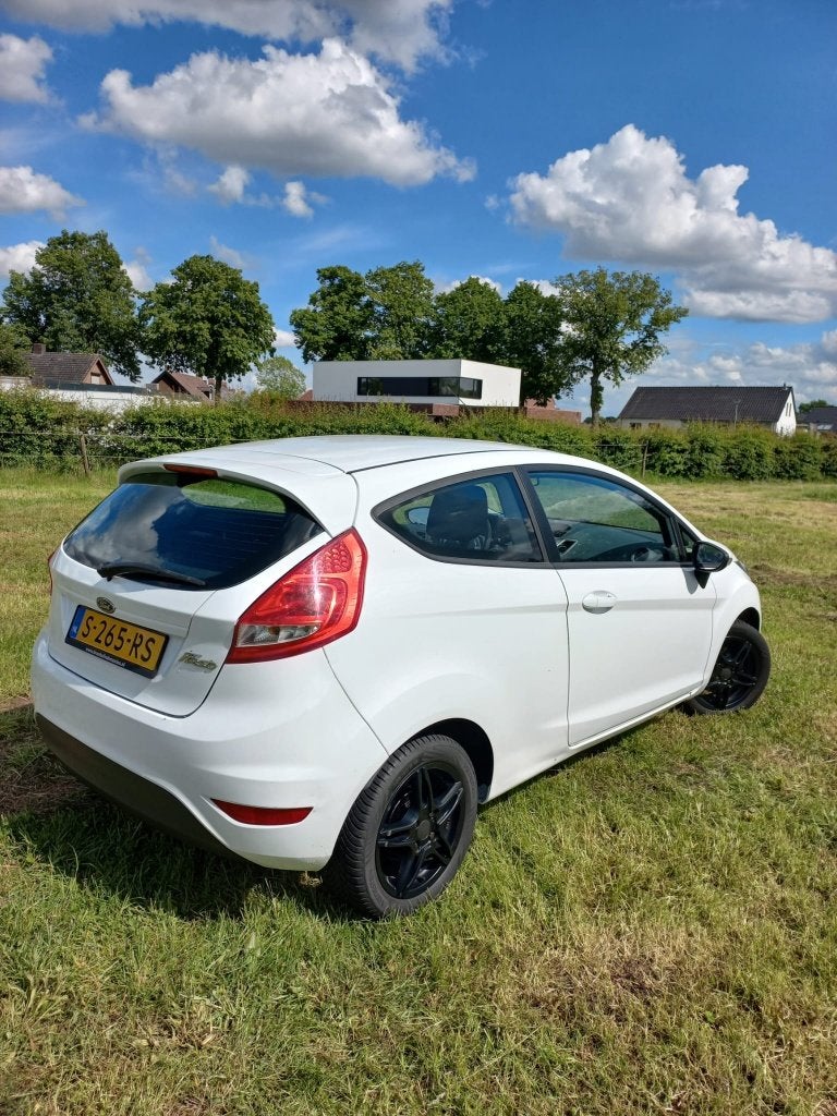 Ford Fiësta 1.25 44KW 3DR 2009 Wit, Auto's, Voorwielaandrijving, Stof, 4 cilinders, Wit