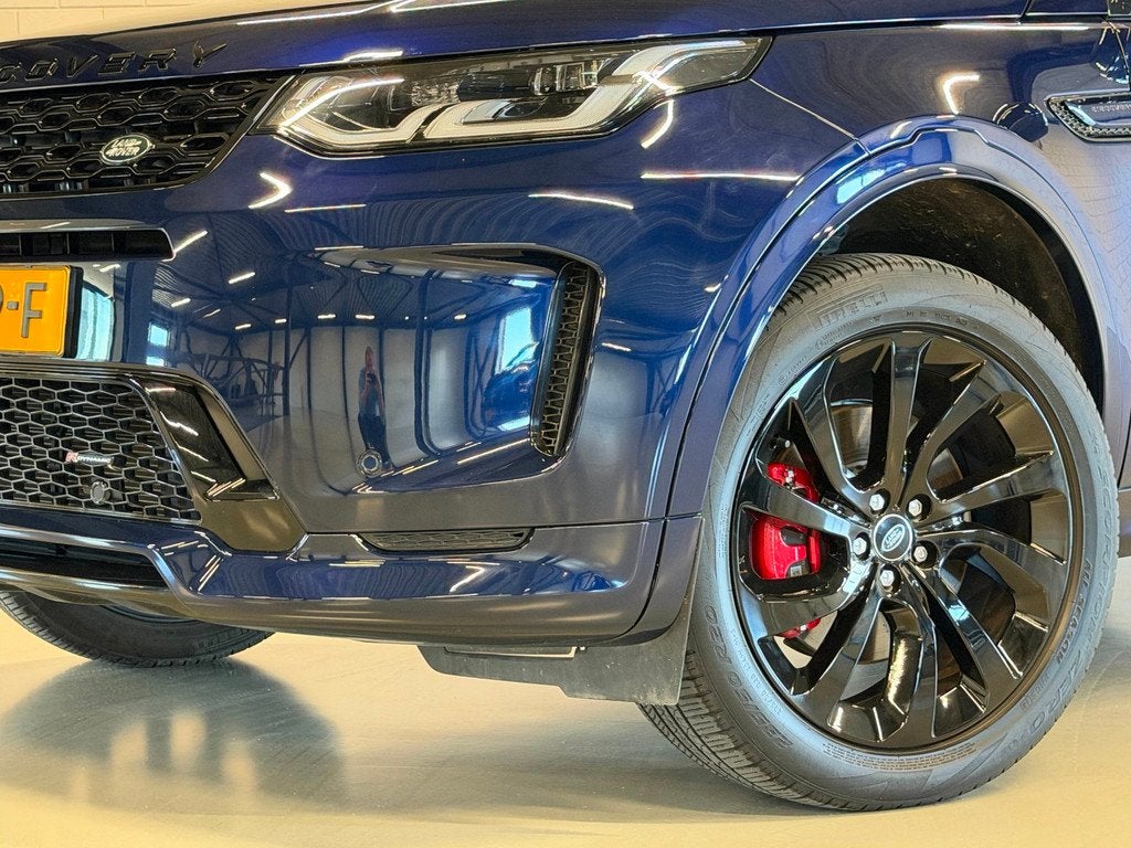 Land Rover DISCOVERY SPORT P300e 1.5 R-Dynamic Black Pack HS, Auto's, Land Rover, 309 pk, Blauw, Discovery Sport, Leder