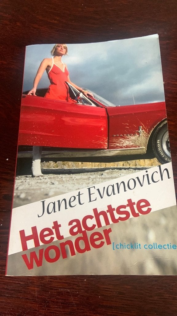Het achtste wonder - Janet Evanovich, Ophalen of Verzenden, Gelezen