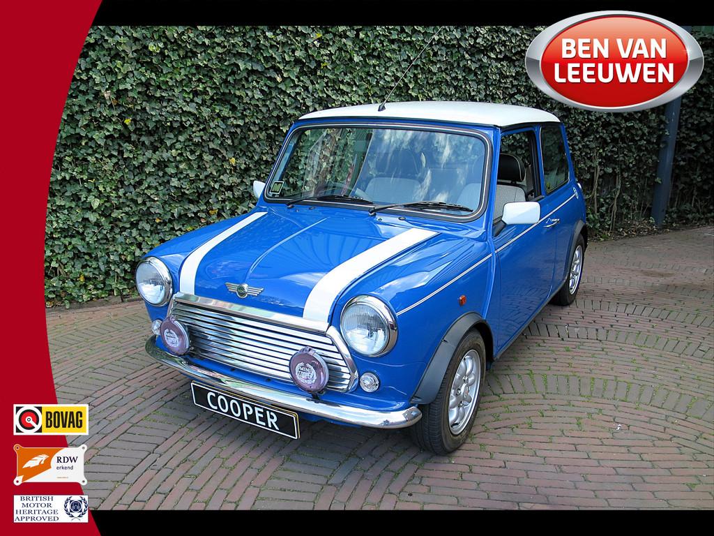 MINI Cooper 1.3 MPI Unieke auto met zeer lage km-stand!, Voorwielaandrijving, 12 maanden, 54 pk, Zwart