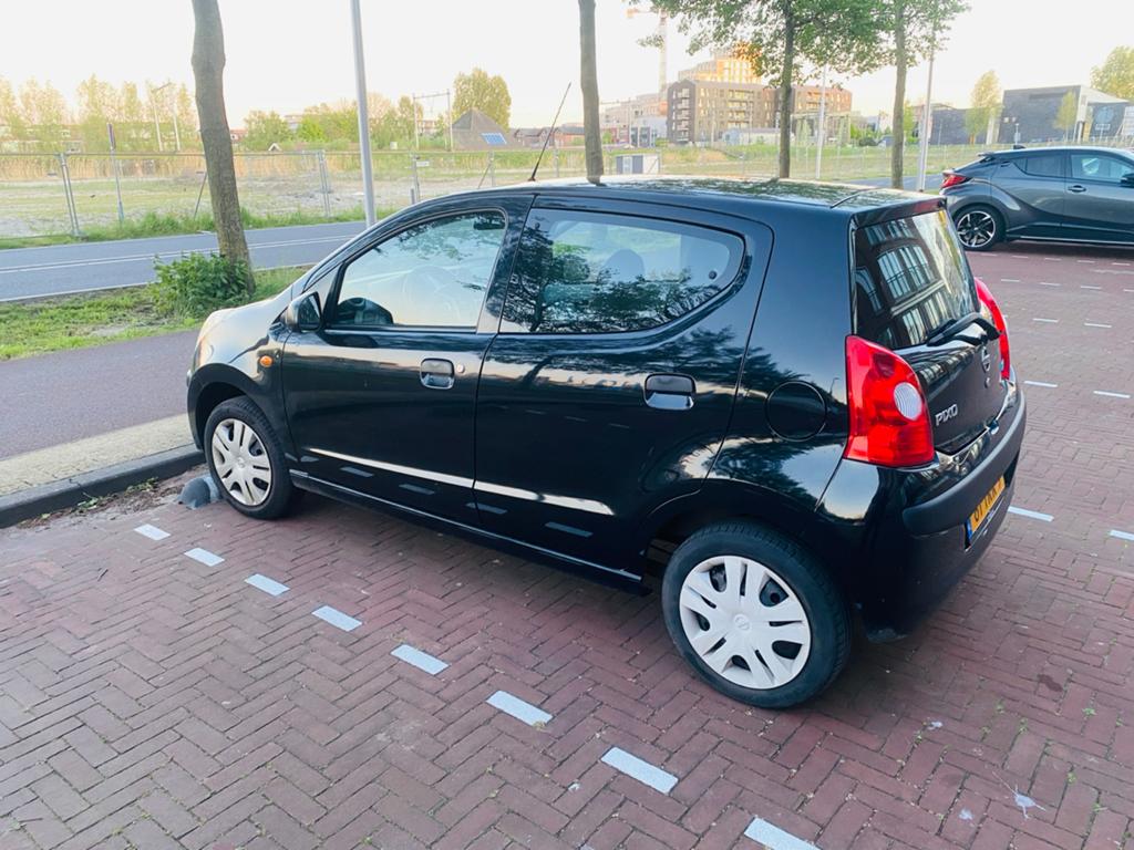 Nissan Pixo 1.0 50KW 5D 2012 Zwart, Auto's, Nissan, Voorwielaandrijving, Euro 5, Stof, 4 stoelen