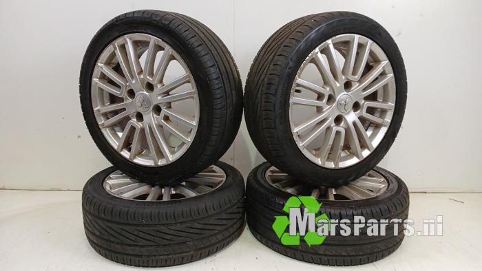 Sportvelgenset + winterbanden van een Mitsubishi Colt, Gebruikt, -, -, Ophalen of Verzenden
