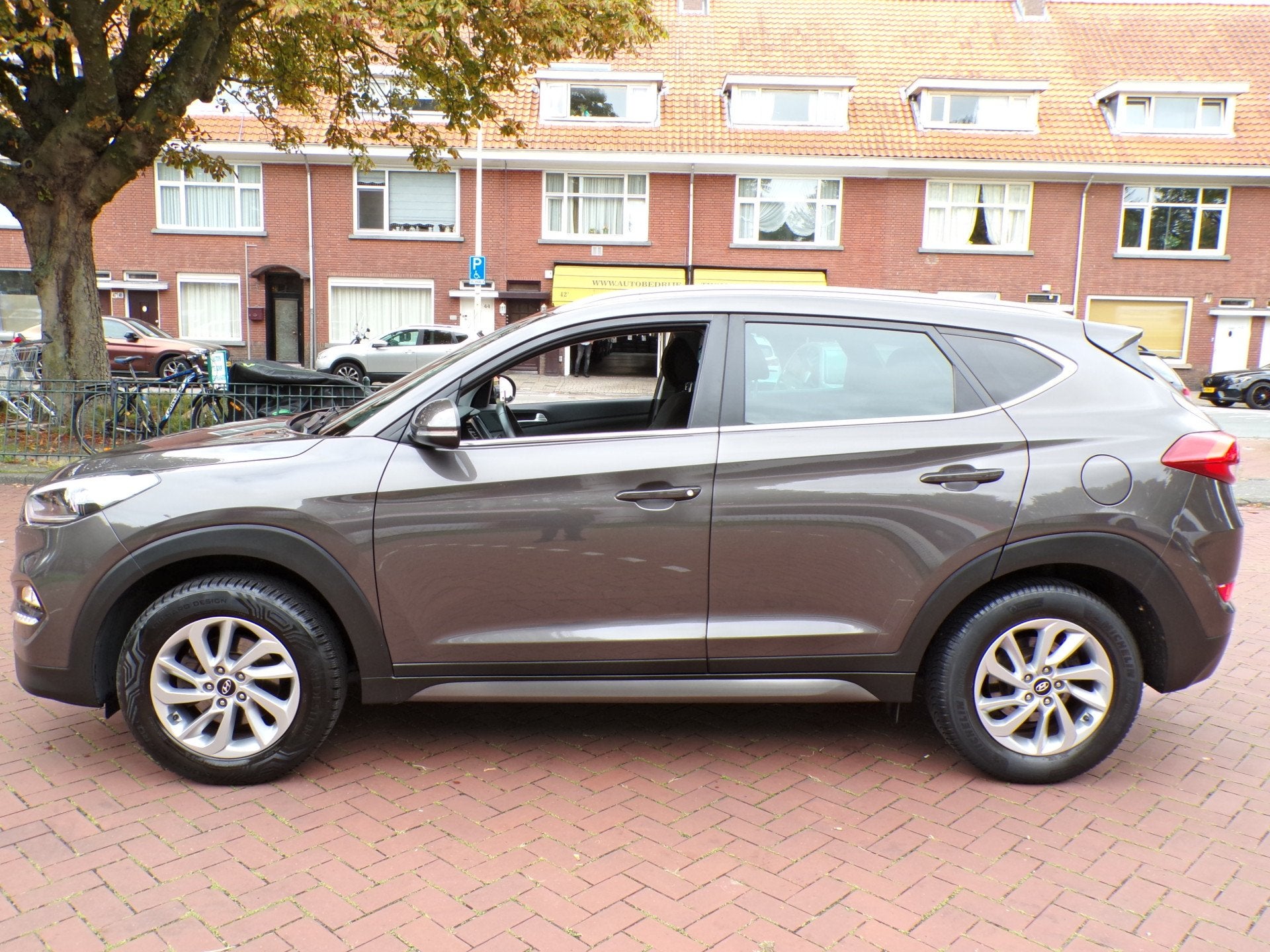 Hyundai Tucson 1.6 GDi Comfort (bj 2016), Voorwielaandrijving, Gebruikt, 4 cilinders, Bruin