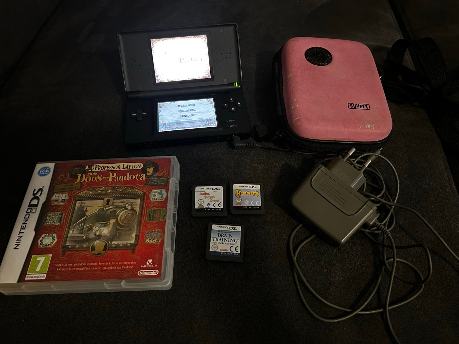 Nintendo DS Lite Zwart met games en speakerhoes, Spelcomputers en Games, Spelcomputers | Nintendo DS, Zwart, Ophalen of Verzenden