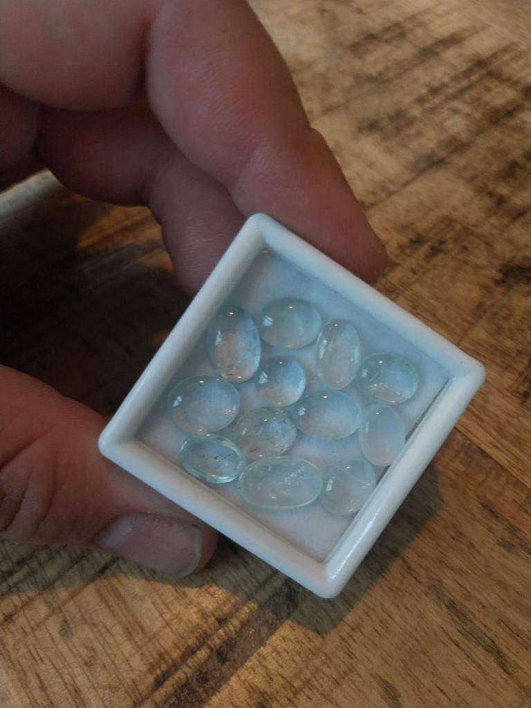 Lot met lichtblauwe aquamarijn cabochond, Ophalen of Verzenden, Zo goed als nieuw