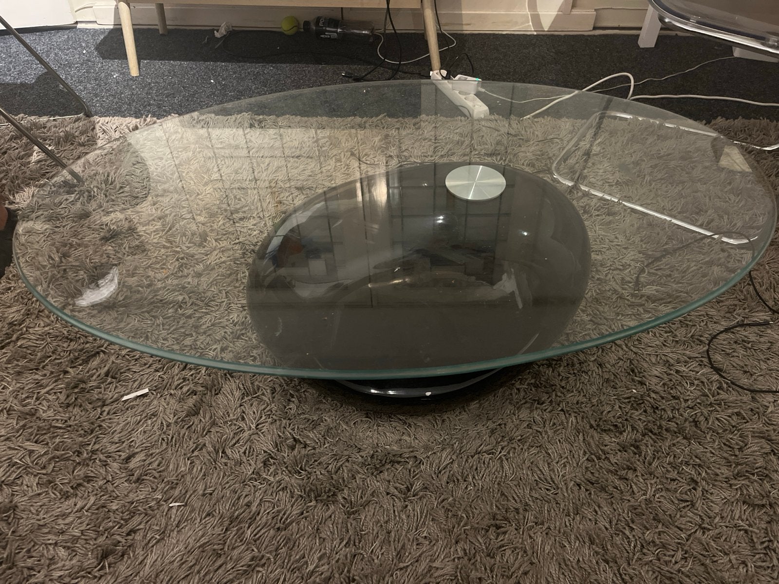 Glazen salontafel met zwarte ovale voet, Gebruikt, 100 tot 150 cm, Ophalen of Verzenden, Glas