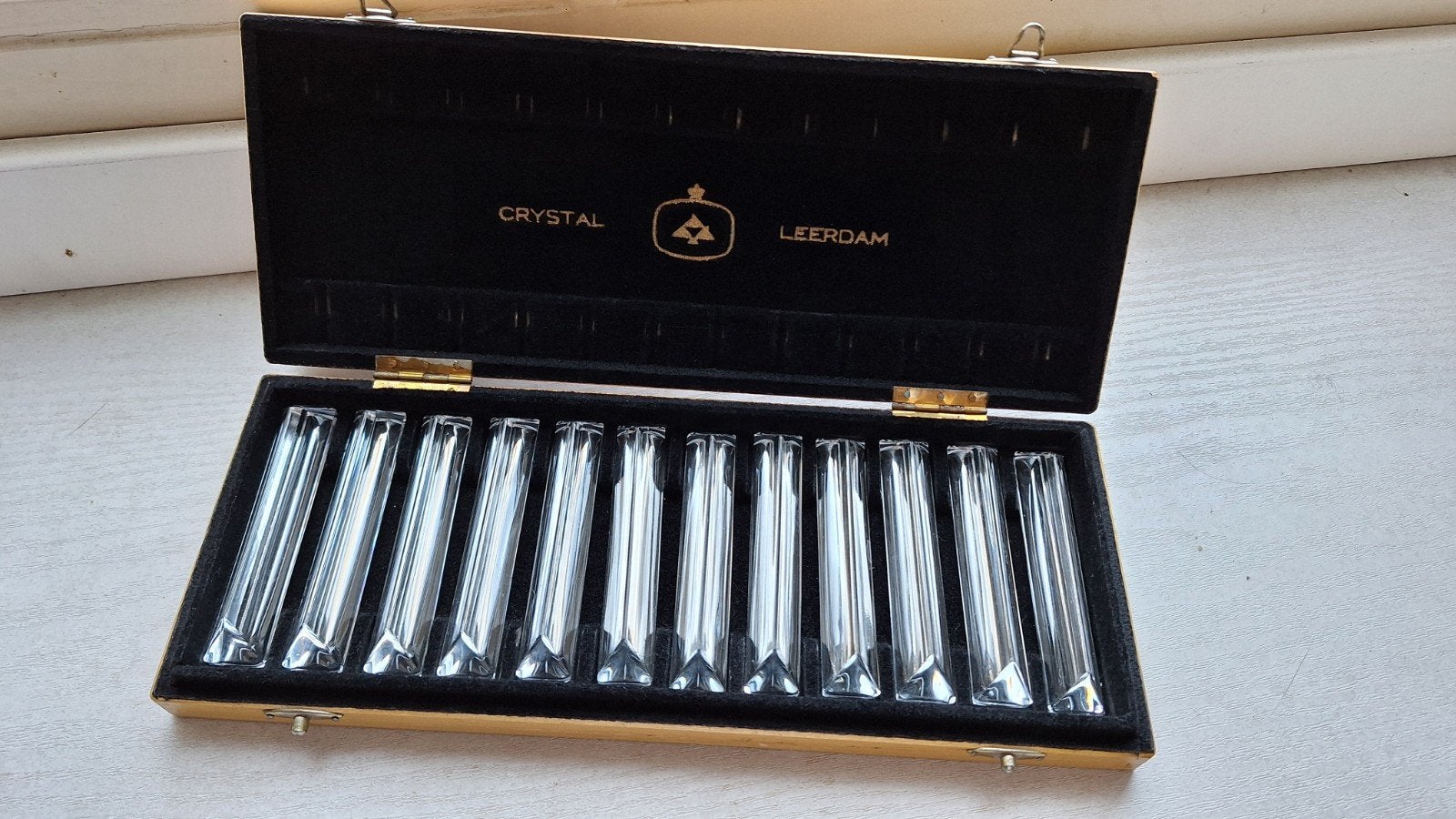 Set van 12 Crystal Leerdam messenleggers in houten kistje, Ophalen