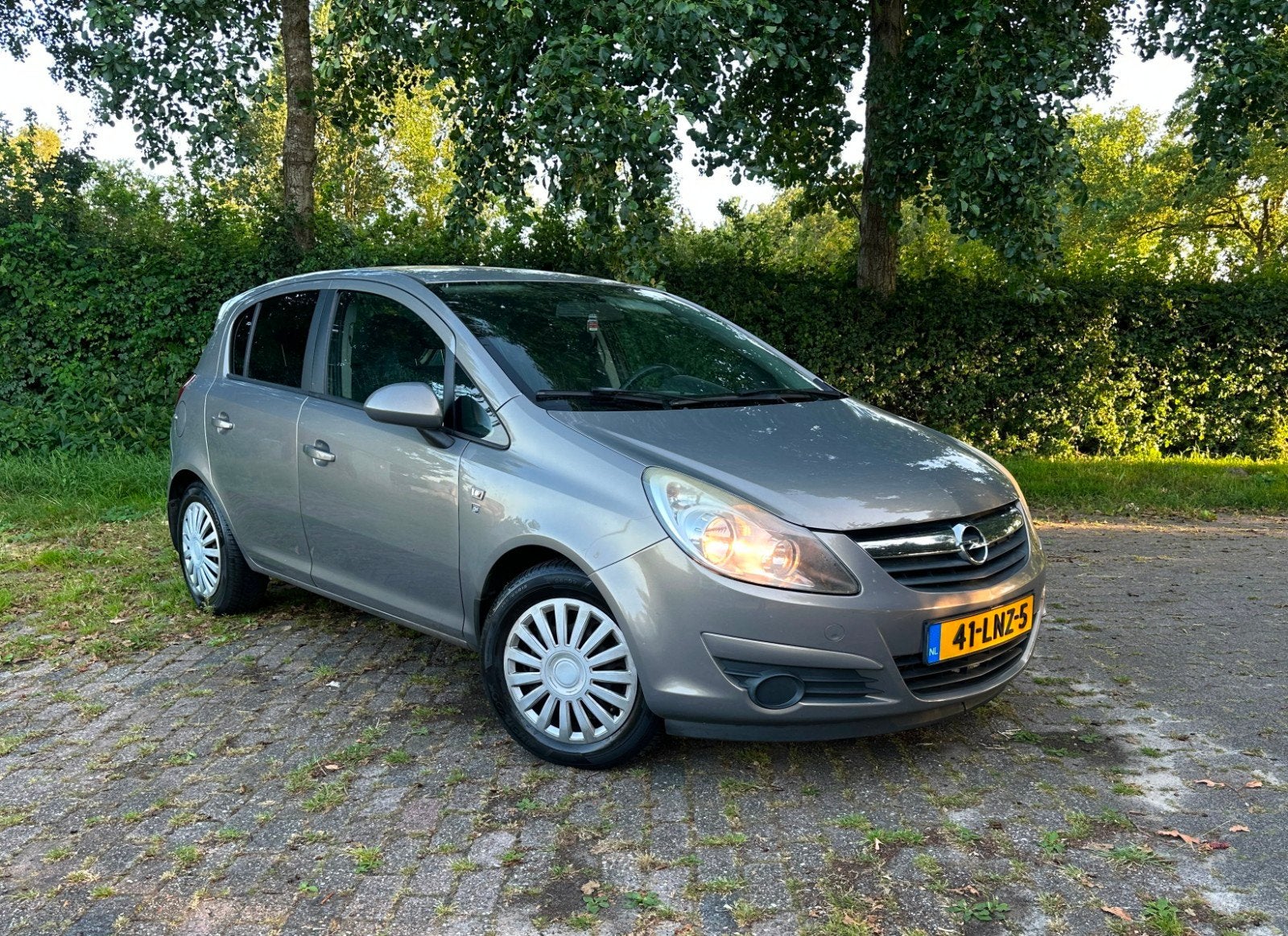 Opel Corsa 1.2 Twinport 85pk 5d 2010 Bruin, Auto's, Voorwielaandrijving, 4 cilinders, Bruin, 1229 cc
